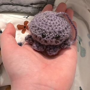Small octopus. Available as is or as a keychain.